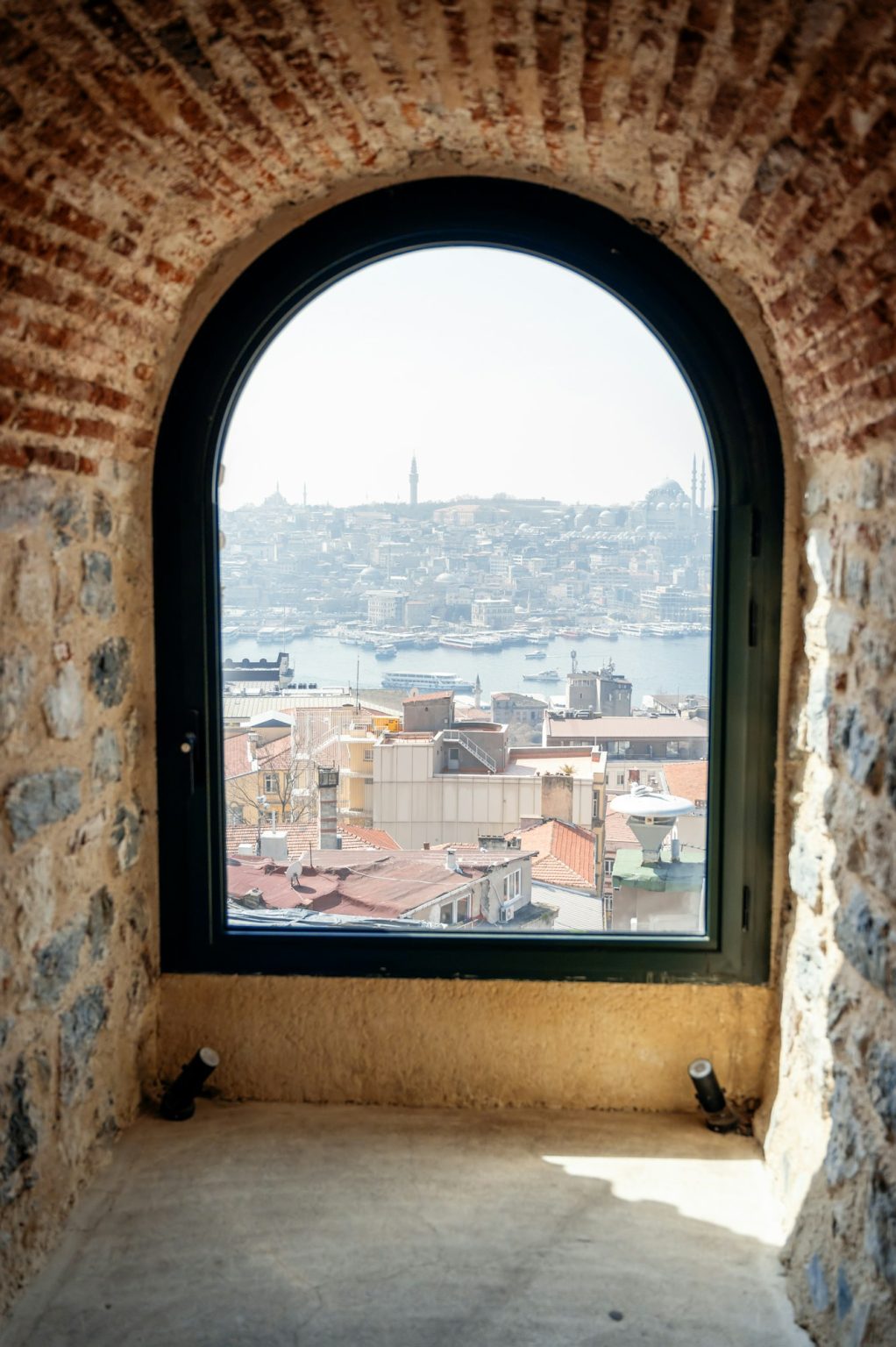 Cityscape of Istanbul through the ancient window of Galata Tower, Turkey